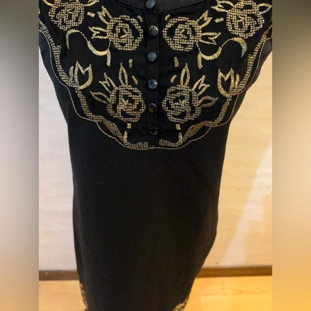 Free People sleeveless black dress with gold metallic embroidery.